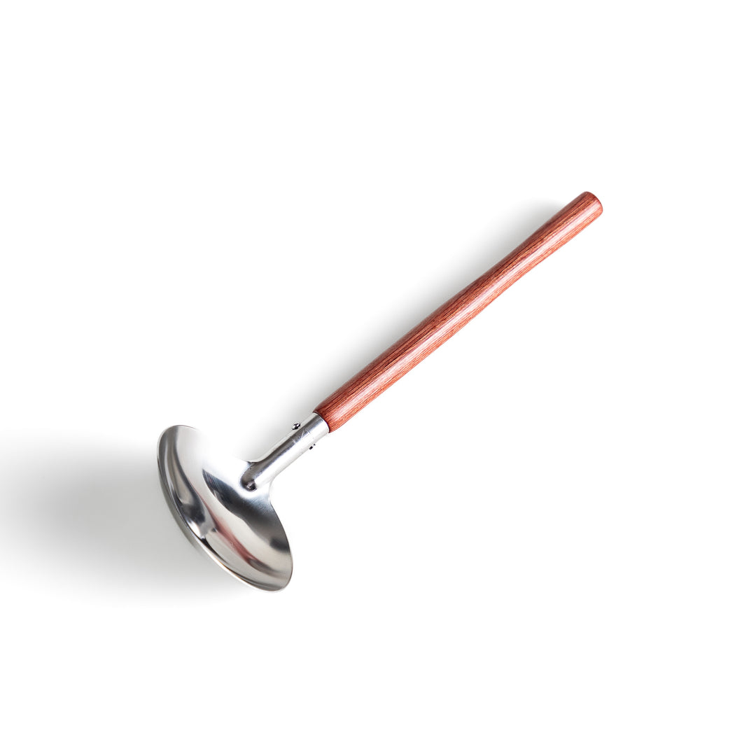 Durable wooden and stainless steel ladle, essential kitchenware for cooking.