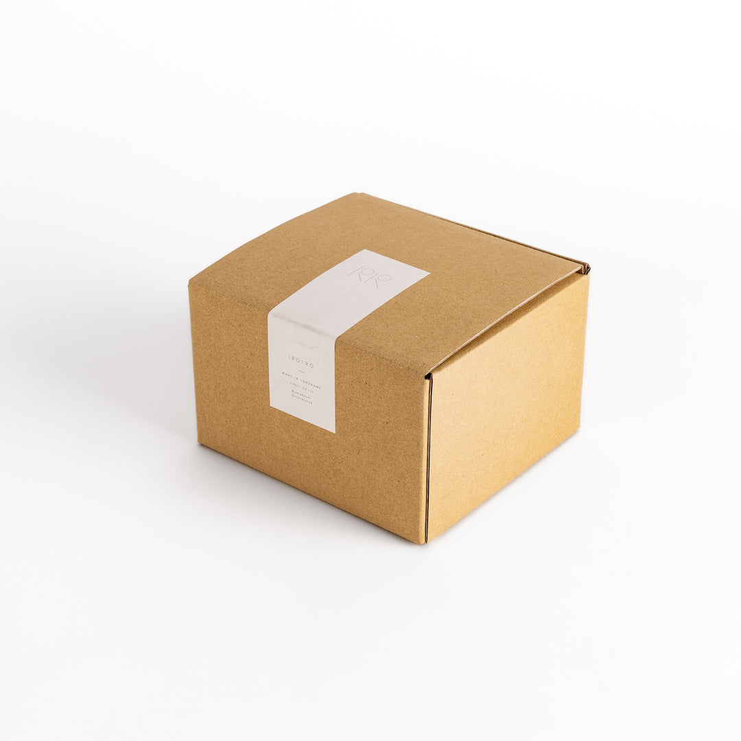 Packaging box for the beige teapot, designed to provide protection and elegant presentation for gifting or storage.