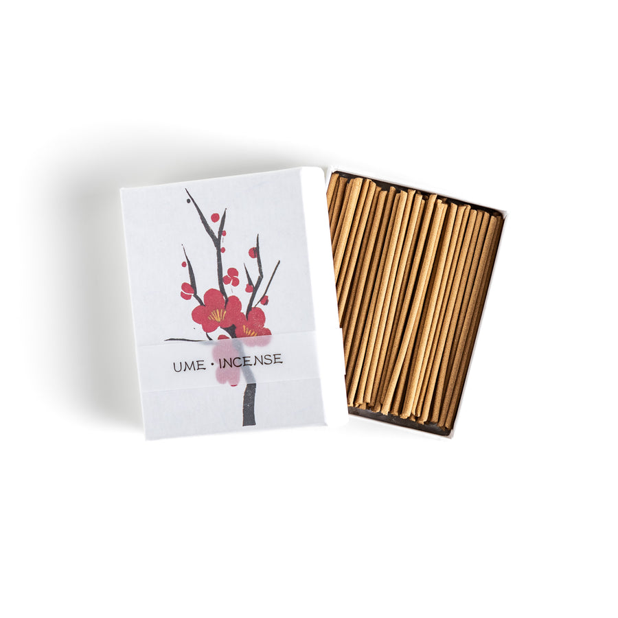 Incense featuring warm brown sticks in a box decorated with a delicate plum blossom illustration, offering a sweet and subtly floral fragrance inspired by Japanese ume flowers.