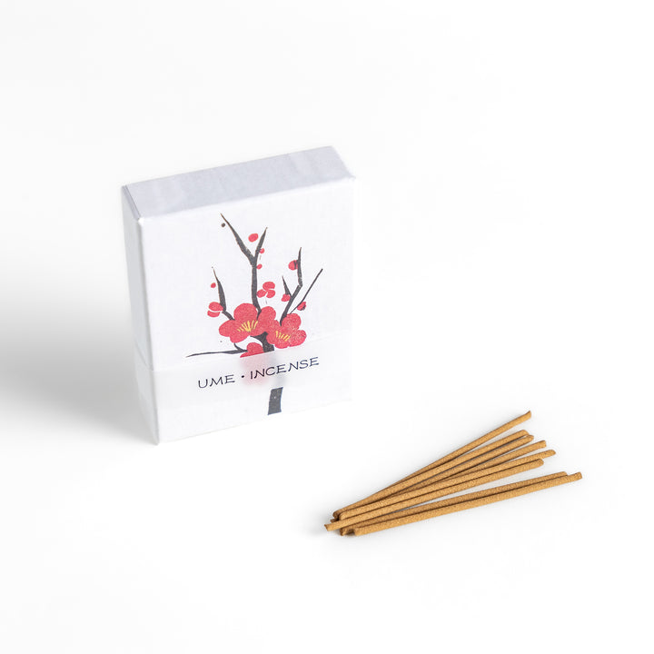 Incense featuring warm brown sticks in a box decorated with a delicate plum blossom illustration, offering a sweet and subtly floral fragrance inspired by Japanese ume flowers.