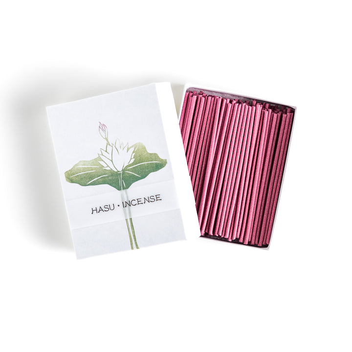 Incense featuring soft pink sticks in a box adorned with a delicate lotus flower design, offering a gentle and floral fragrance for a serene atmosphere.