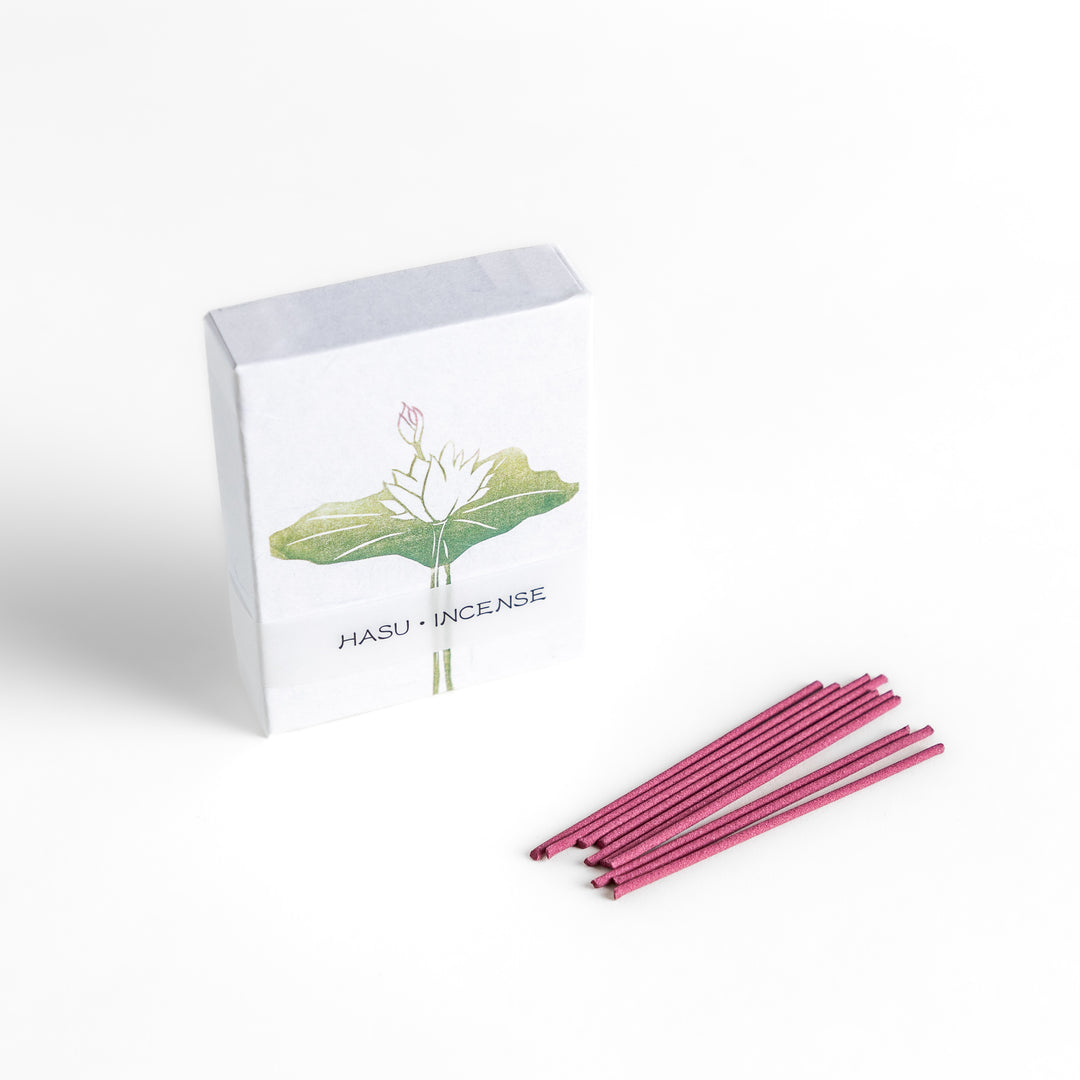 Incense featuring soft pink sticks in a box adorned with a delicate lotus flower design, offering a gentle and floral fragrance for a serene atmosphere.