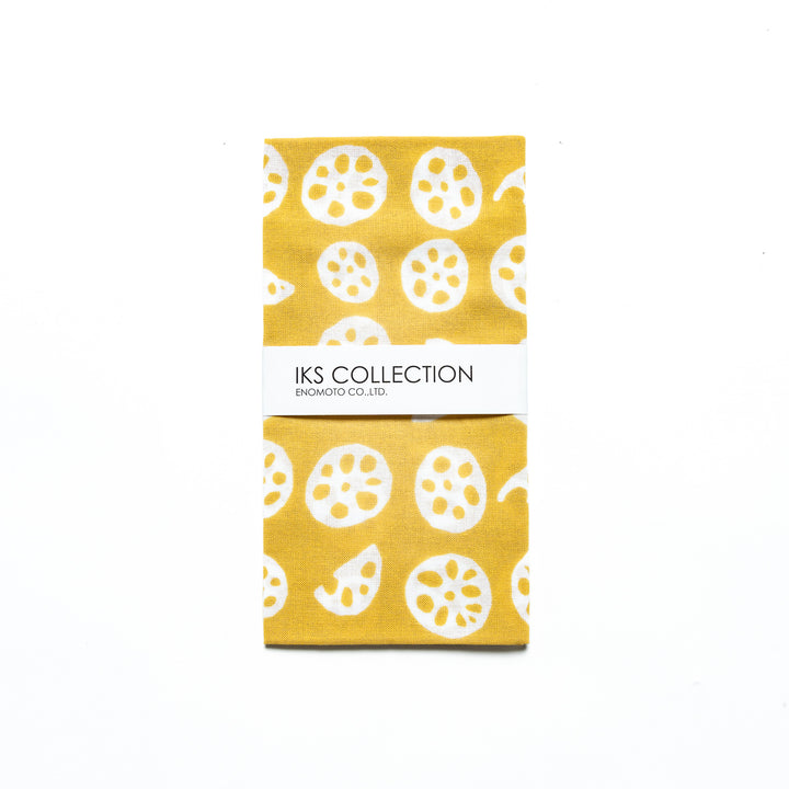 Yellow hand towel with white lotus root slice motifs, folded with a branded sleeve.