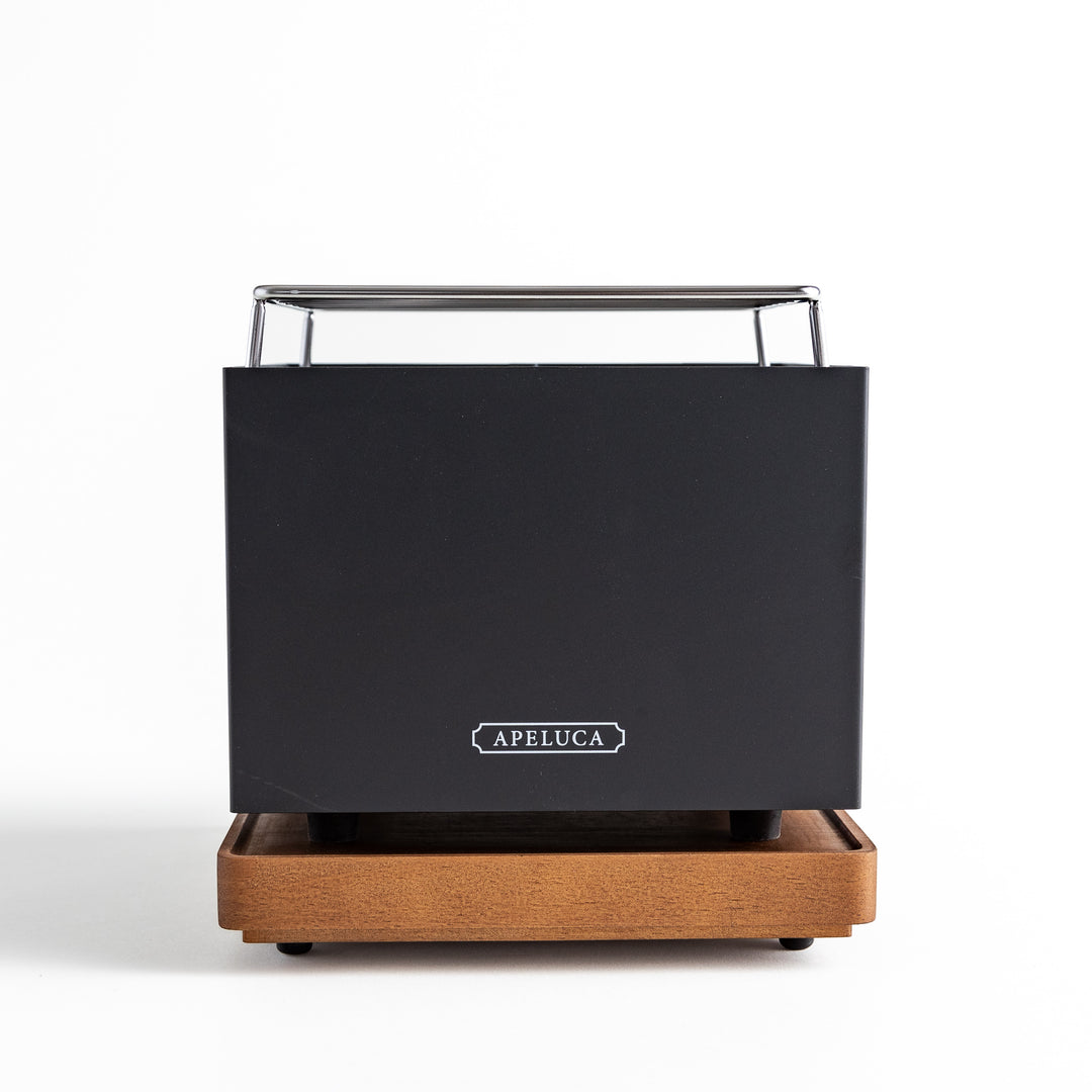 A black box resting on a wooden stand, showcasing a stylish and functional design.