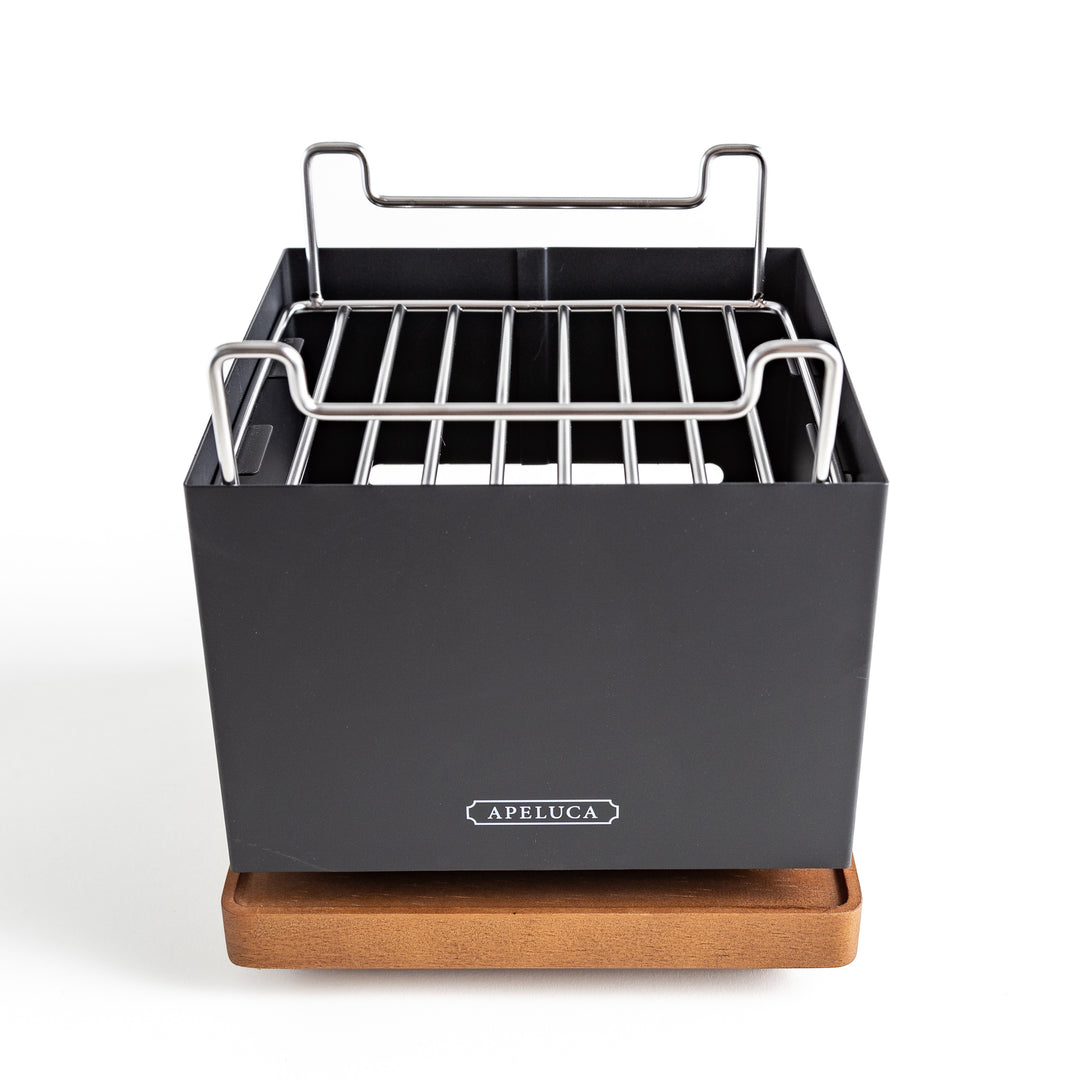 A sleek black grill featuring a sturdy metal grate, perfect for outdoor cooking and gatherings.