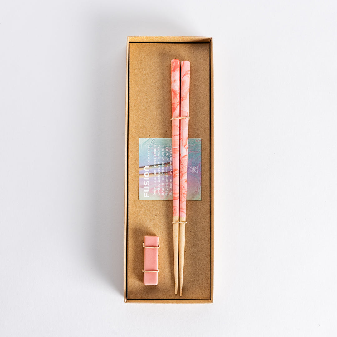 Rose Petal Fusion Chopsticks set, elegantly presented in a box with a soft pink marbled design, complemented by matching chopstick rests for a refined dining experience.