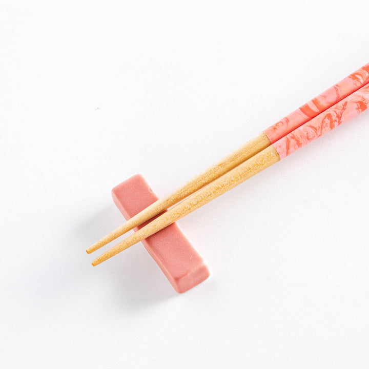 Detailed view of the Rose Petal Fusion Chopsticks showing the gentle pink marble swirl design along the smooth, bamboo tips.