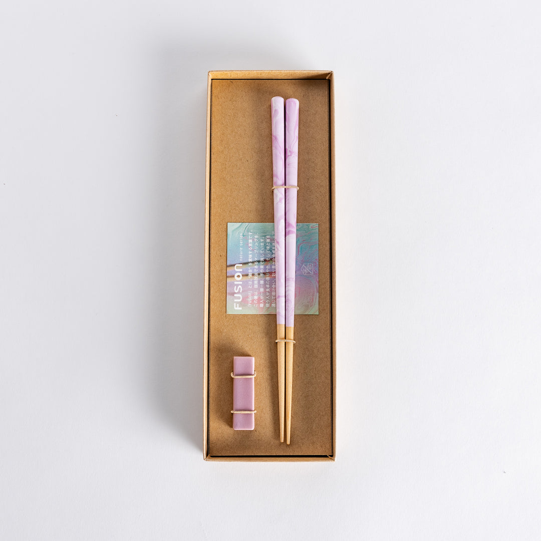 Chopsticks featuring a soft lavender swirl design on the tips with wooden shafts. Elegant and stylish, perfect for adding charm to any table setting.