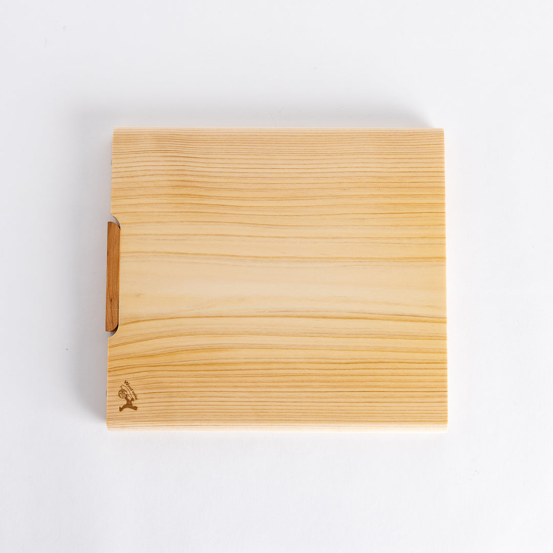 Top view of a rectangular cutting board made of light-colored hinoki wood, showcasing a smooth surface and a natural wood grain pattern.