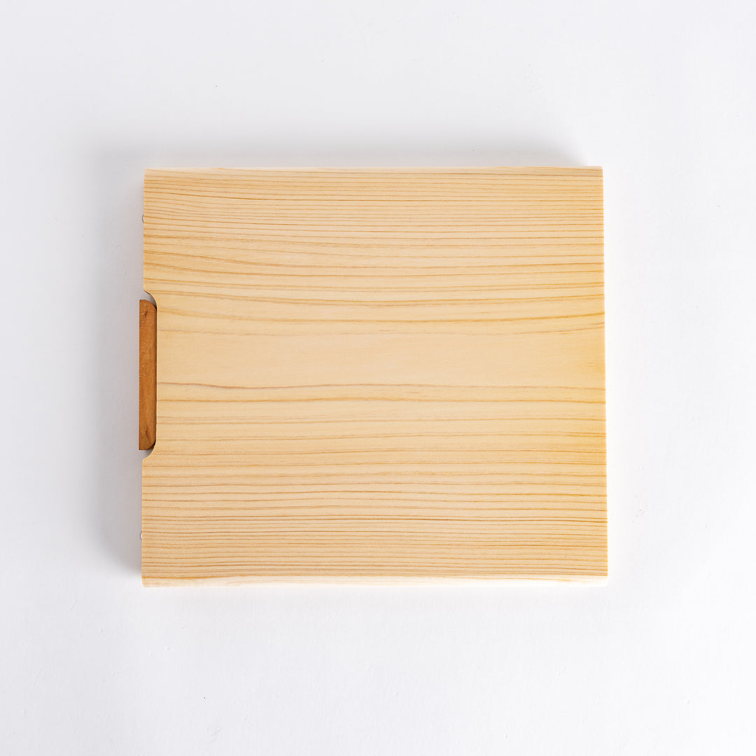 Overall view of the cutting board, emphasizing its light color, smooth texture, and functional design suitable for various kitchen tasks.