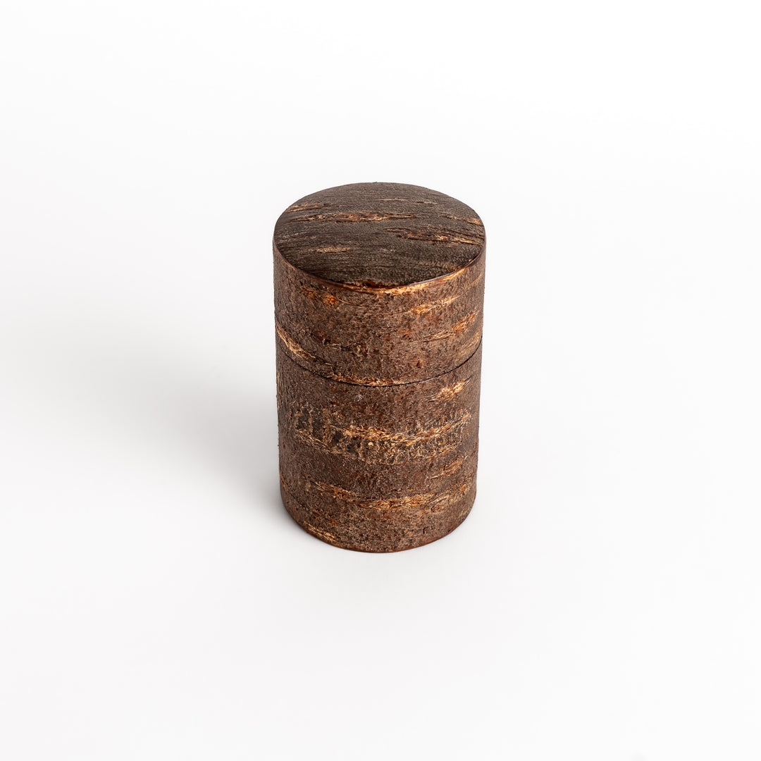 Rustic cherry bark tea canister with a deep brown finish and natural texture, perfect for storing and preserving loose leaf tea.