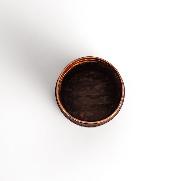 Rustic cherry bark tea canister with a deep brown finish and natural texture, perfect for storing and preserving loose leaf tea.