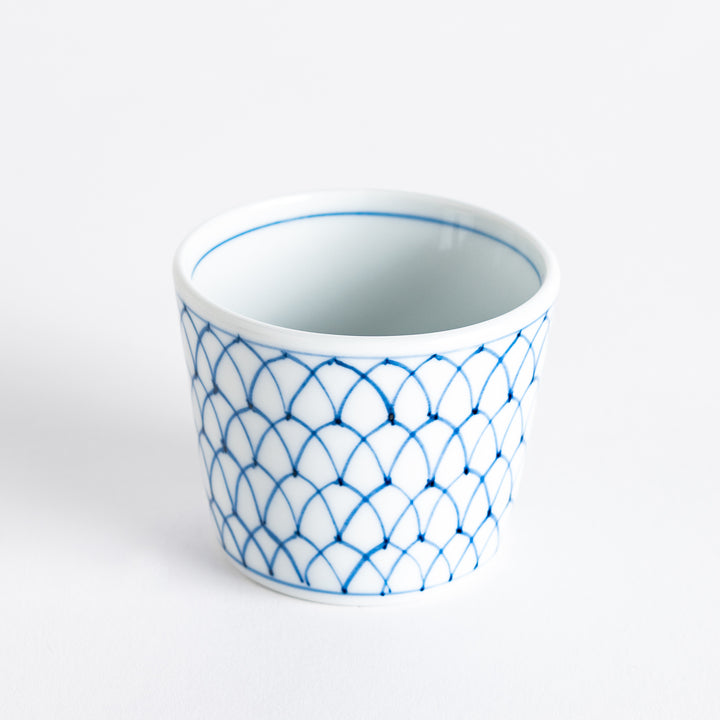 Small white condiment bowl with a blue mesh pattern.