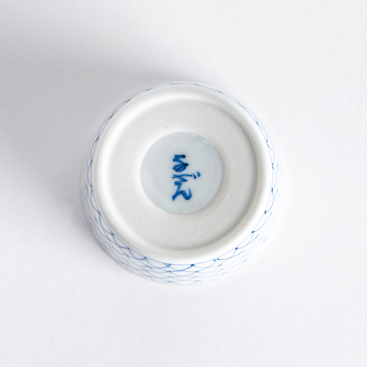 Small white condiment bowl with a blue mesh pattern.