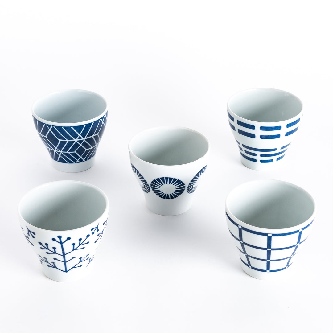 Five Modern Indigo Cups arranged with different geometric patterns. 