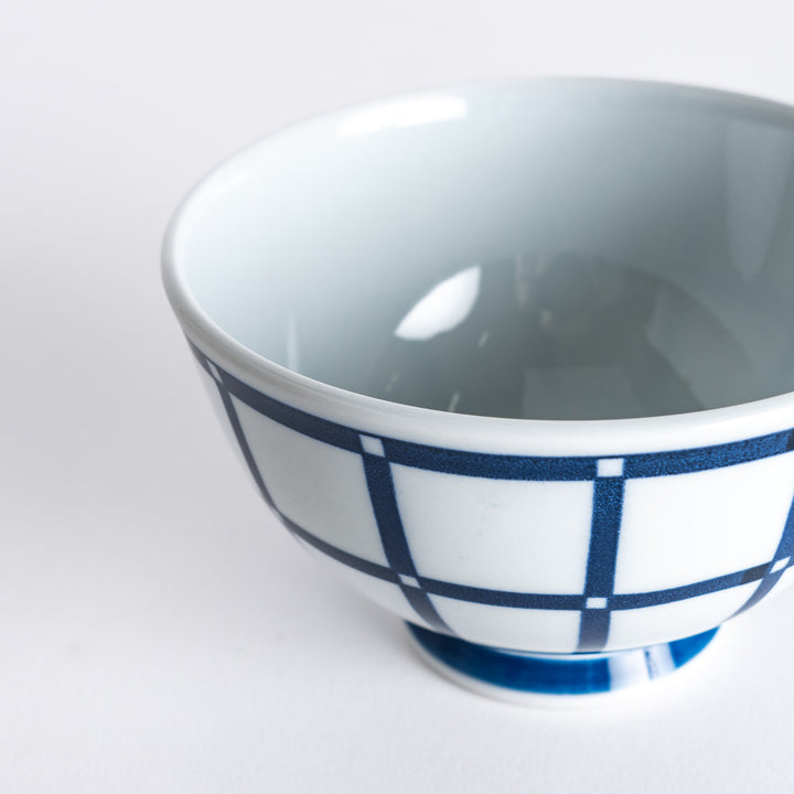 Close-up of the Modern Indigo Lattice Rice Bowl, highlighting the detailed navy blue lattice pattern and smooth rim.