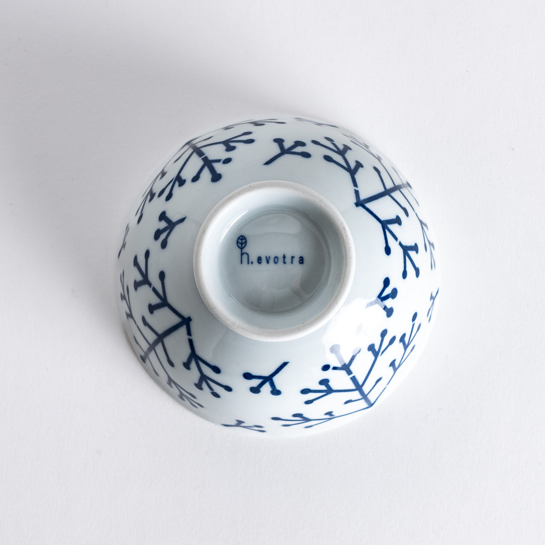 Bottom view of the Modern Indigo Pine Rice Bowl, showing the smooth white surface and blue base with no additional markings.