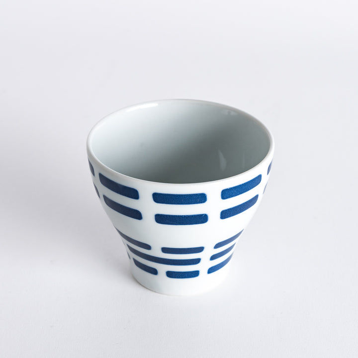 Slightly angled view of the Modern Indigo River Cup, featuring navy blue stripes on a white background.