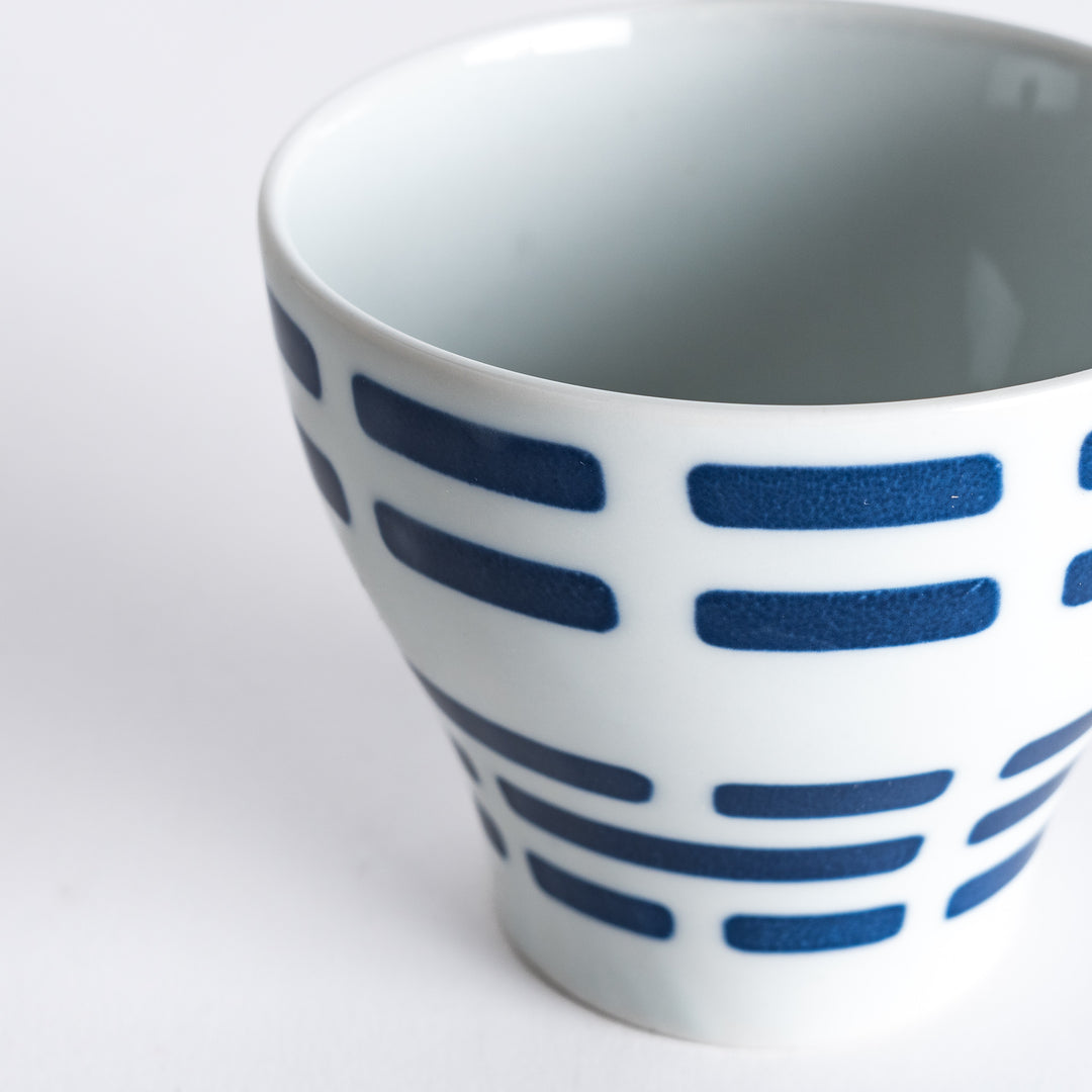 Close-up of the Modern Indigo River Cup with navy blue stripes in a sleek flared design.