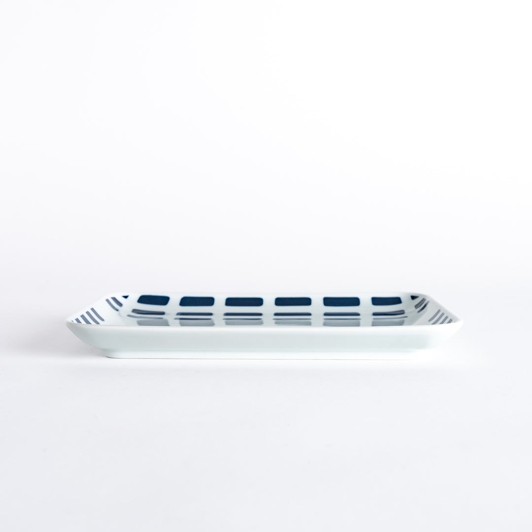 Side view of the Modern Indigo River Dinner Plate, highlighting its smooth edge and contemporary design.