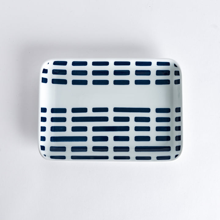 Top-down view of the Modern Indigo River Dinner Plate, featuring navy blue rectangular patterns on a white background.