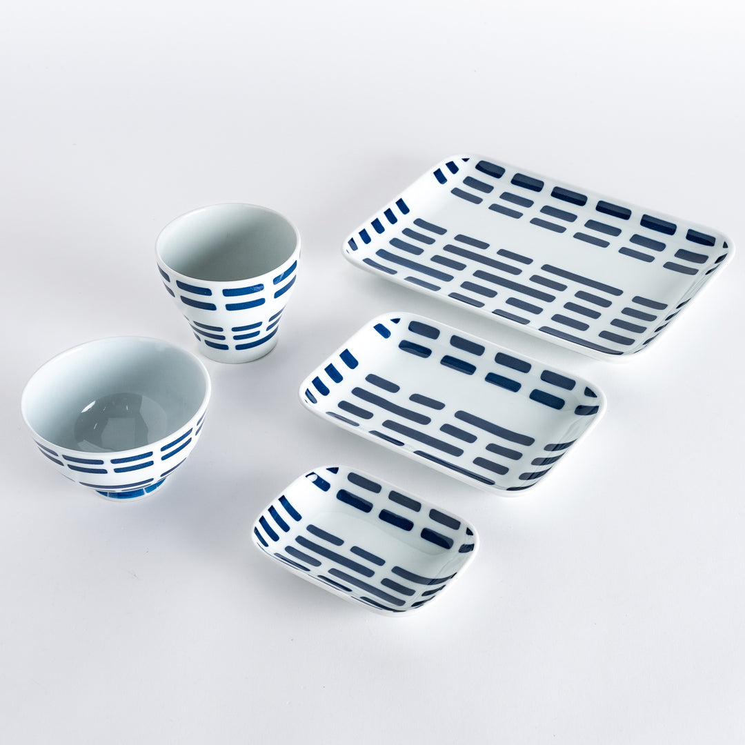 Five pieces featuring the Modern Indigo River design, including two cups, two rectangular plates, and a small dish.