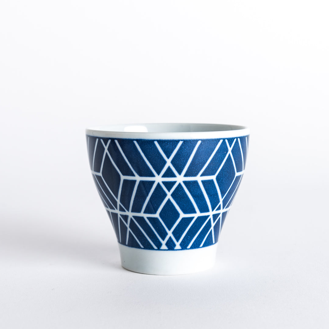 Side view of the Modern Indigo Tile Cup, showcasing the intricate white geometric tile design against the deep blue background.