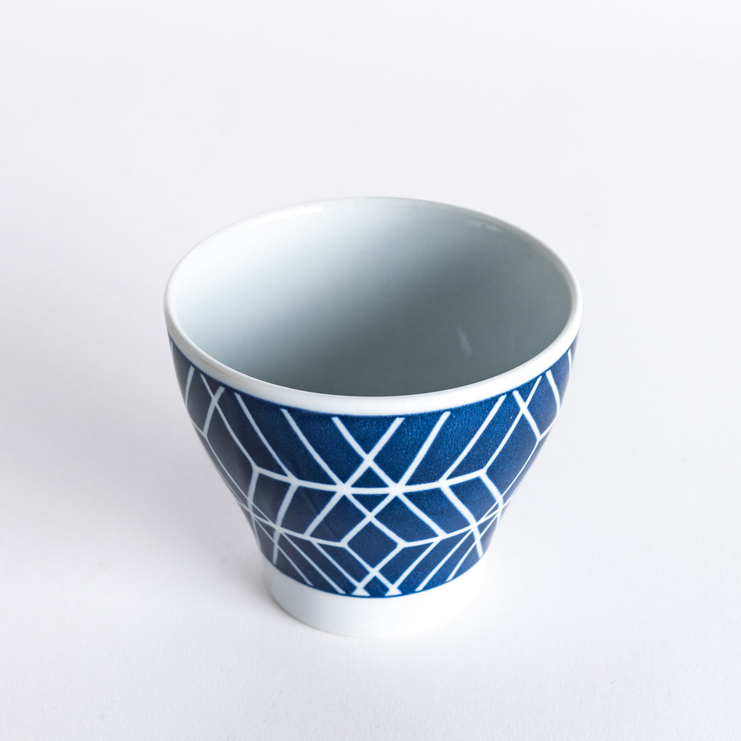 Slightly angled view of the Modern Indigo Tile Cup, showing its elegant geometric white pattern and smooth rim.