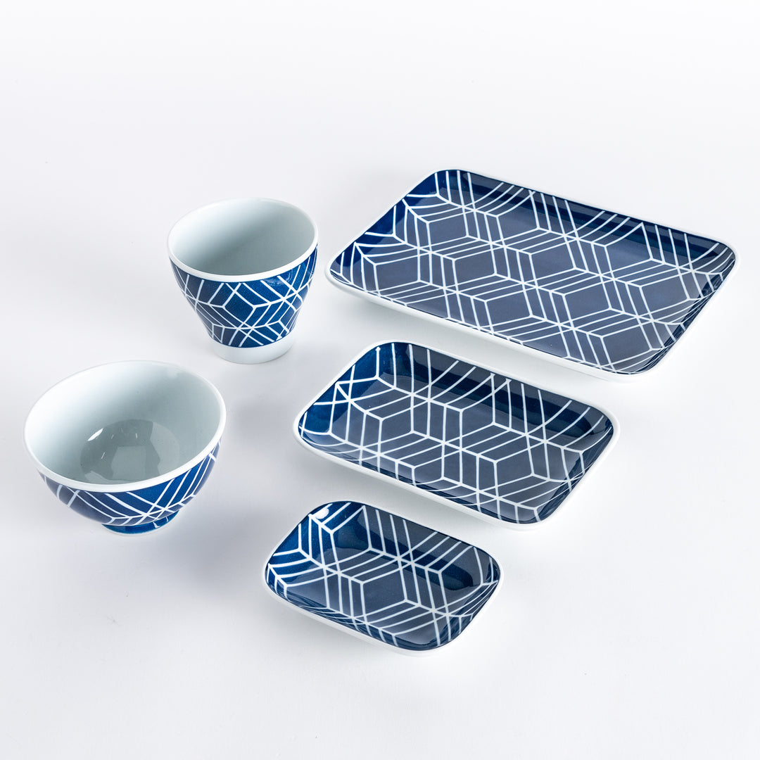 Five pieces featuring the Modern Indigo Tile design, including two cups, two rectangular plates, and a small dish.