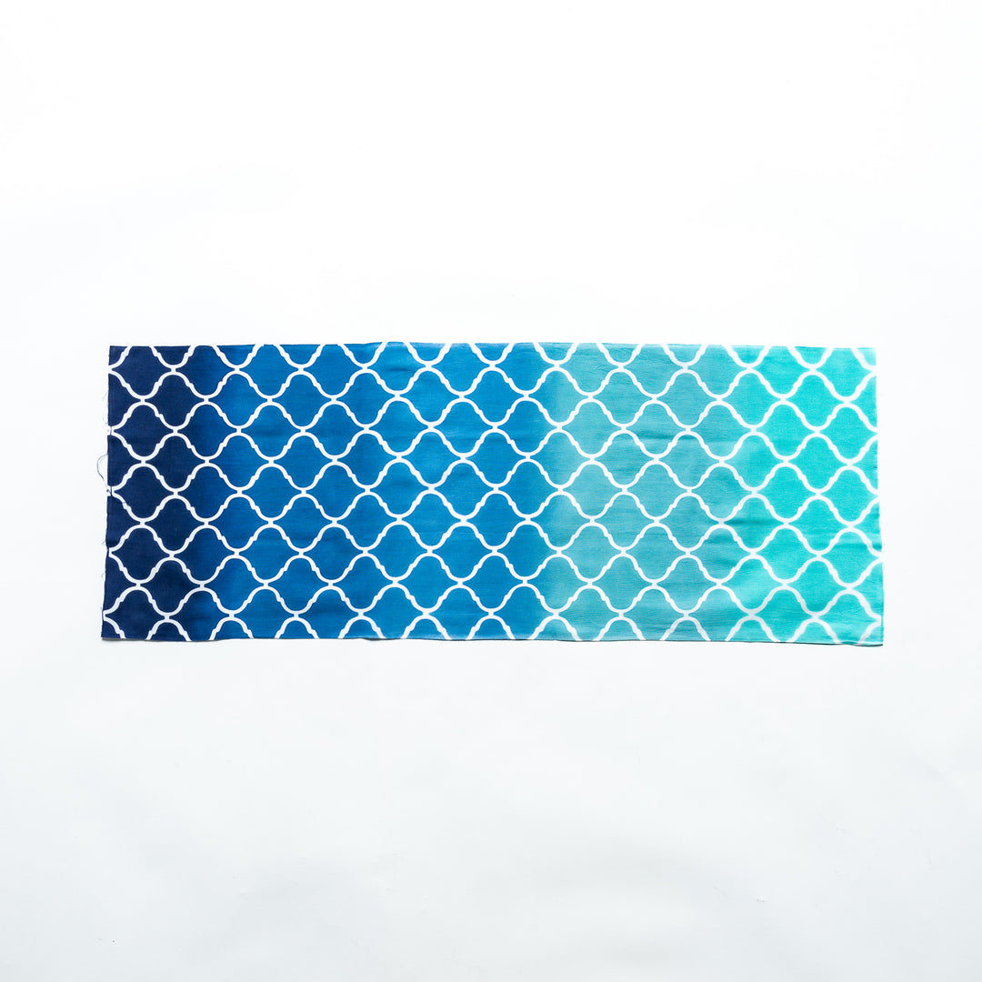 Moroccan tile-patterned blue tenugui hand towel laid flat, showcasing its full design.