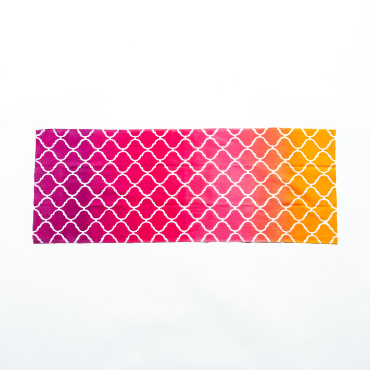 Moroccan tile-patterned pink tenugui hand towel laid flat, showcasing its full design.