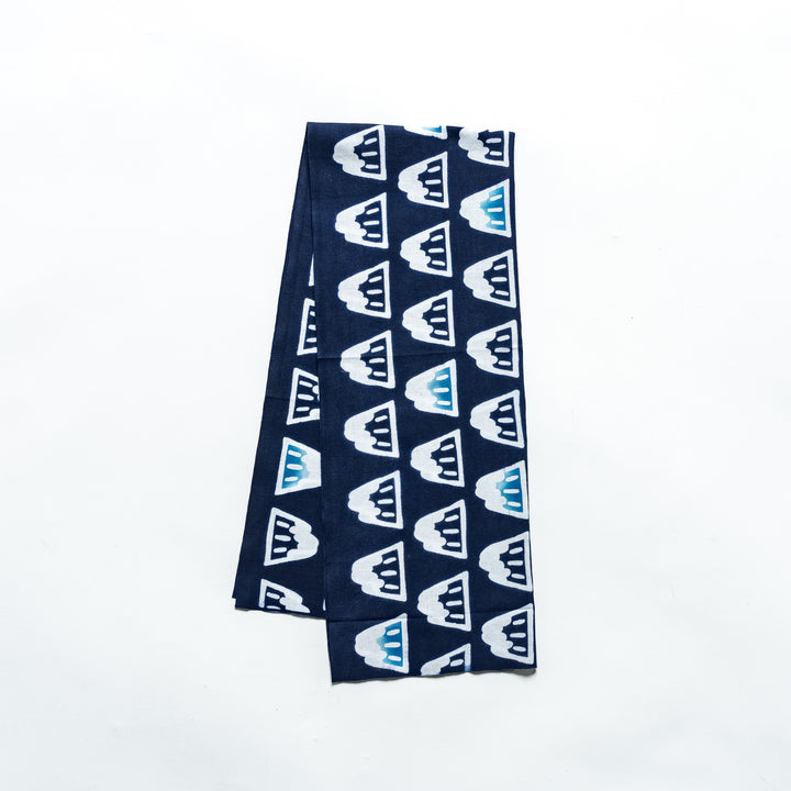 Navy blue tenugui with a repeating pattern of white and blue Mount Fuji designs.