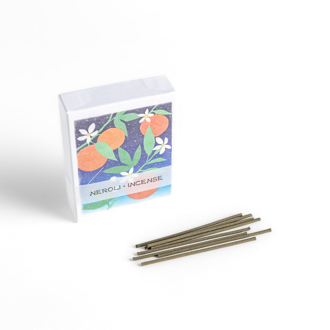 Incense featuring natural-toned sticks in a box adorned with an elegant illustration of neroli flowers and oranges, offering a citrusy and refreshing fragrance.