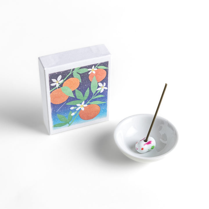 Incense featuring natural-toned sticks in a box adorned with an elegant illustration of neroli flowers and oranges, offering a citrusy and refreshing fragrance.