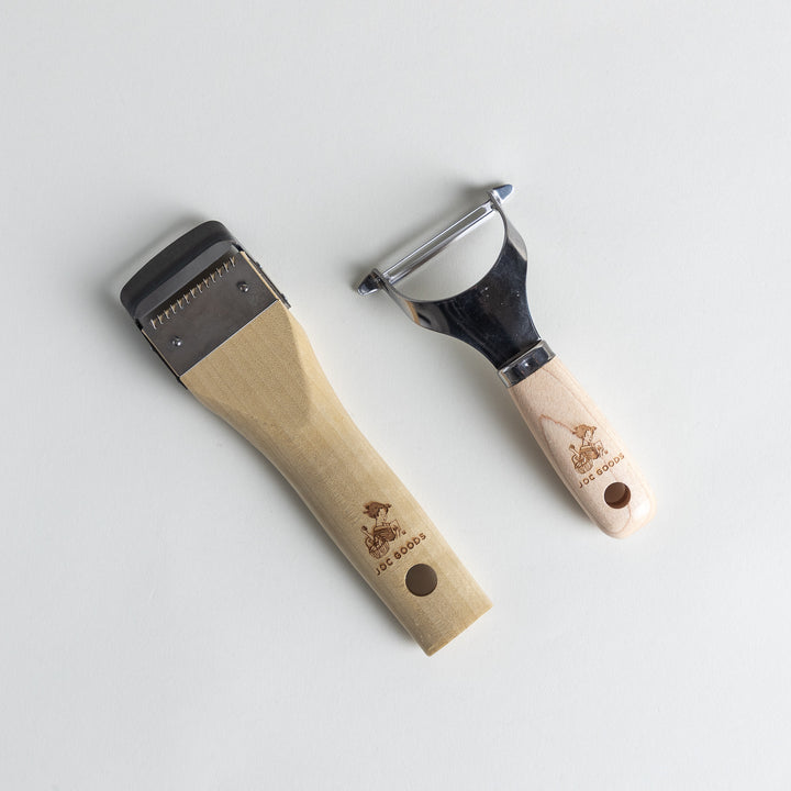 Japanese Wood Handle Peeler and Julienne Peeler Set, featuring ergonomic wooden handles and sharp stainless steel blades, perfect for effortless vegetable peeling and slicing.