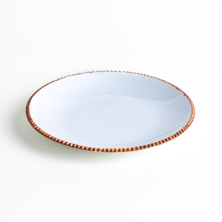 A round white dinner plate with a rustic scallop-edged border. The border comes in blue, brown, and olive.