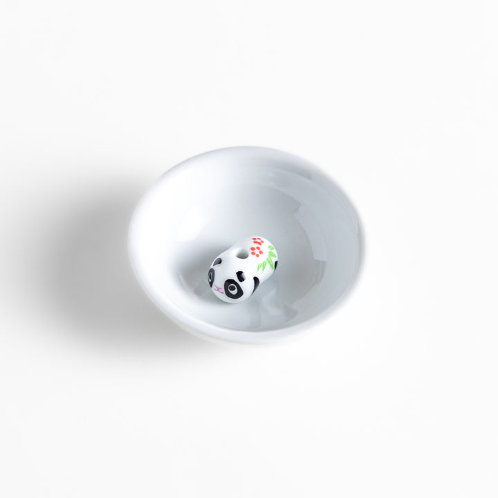 White ceramic incense holder featuring an adorable panda-shaped holder with floral accents, offering a charming and playful touch to incense rituals and home decor.