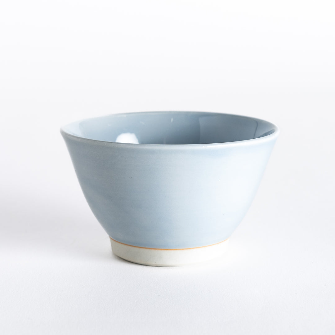 Light blue dessert bowl, captured from the front, showcasing its smooth surface and soft pastel finish.