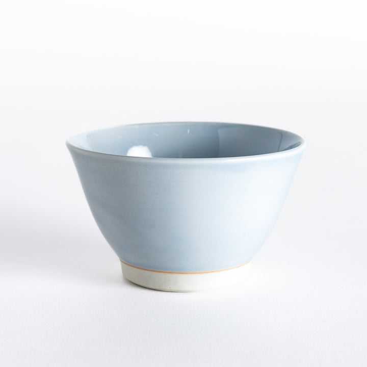 Light blue dessert bowl, captured from the front, showcasing its smooth surface and soft pastel finish.