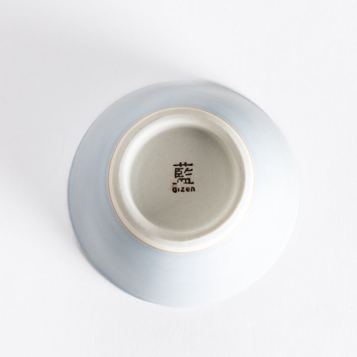 Bottom view of a light blue dessert bowl, featuring a clean white base and a sturdy, simple design.