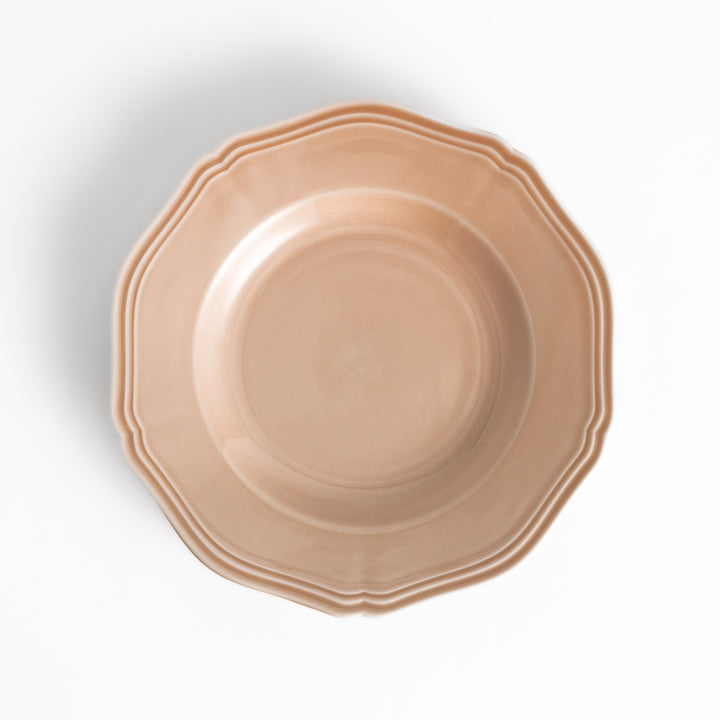 Pretty pink dessert plate with a delicate scalloped edge, ideal for showcasing your favorite treats.