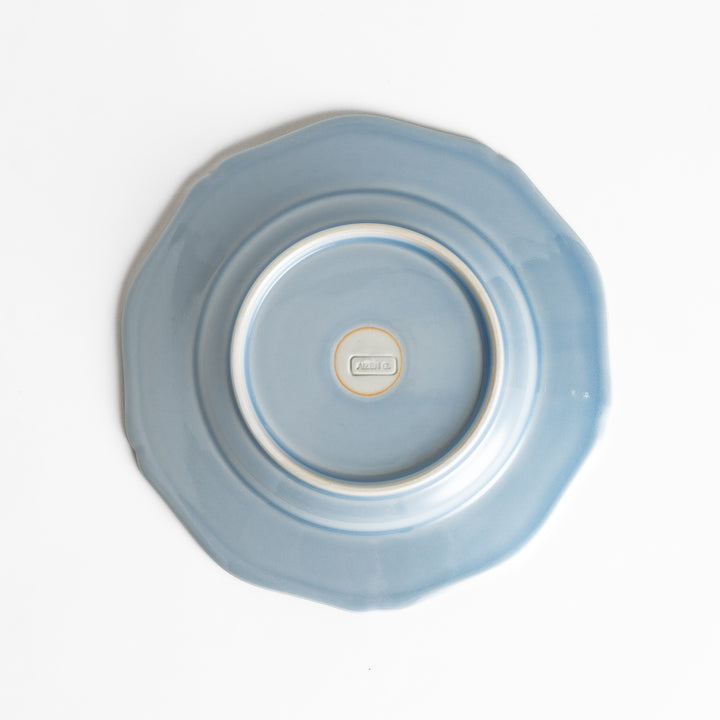 Pretty blue dessert plate with a delicate scalloped edge, ideal for showcasing your favorite treats.