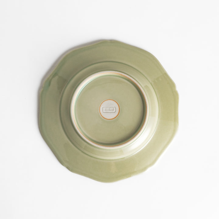 Pretty green dessert plate with a delicate scalloped edge, ideal for showcasing your favorite treats.