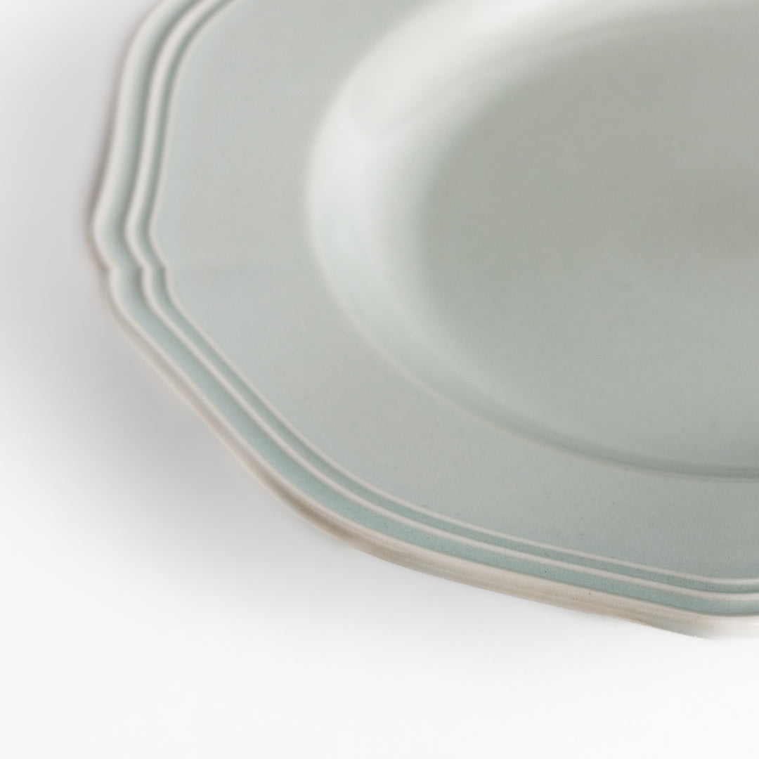 Pretty white dessert plate with a delicate scalloped edge, ideal for showcasing your favorite treats.