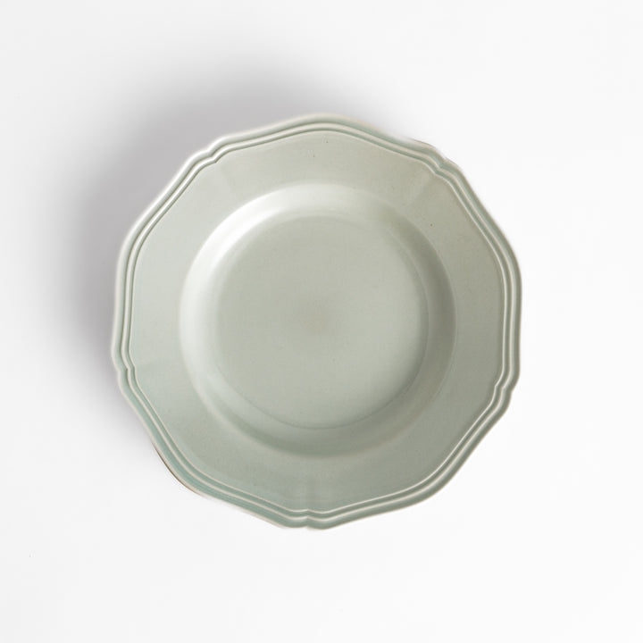 Pretty white dessert plate with a delicate scalloped edge, ideal for showcasing your favorite treats.