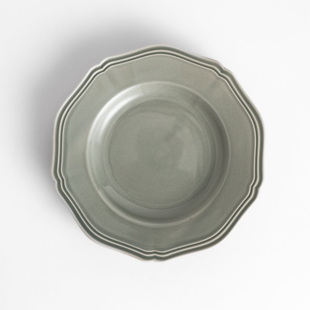 Pretty gray dessert plate with a delicate scalloped edge, ideal for showcasing your favorite treats.