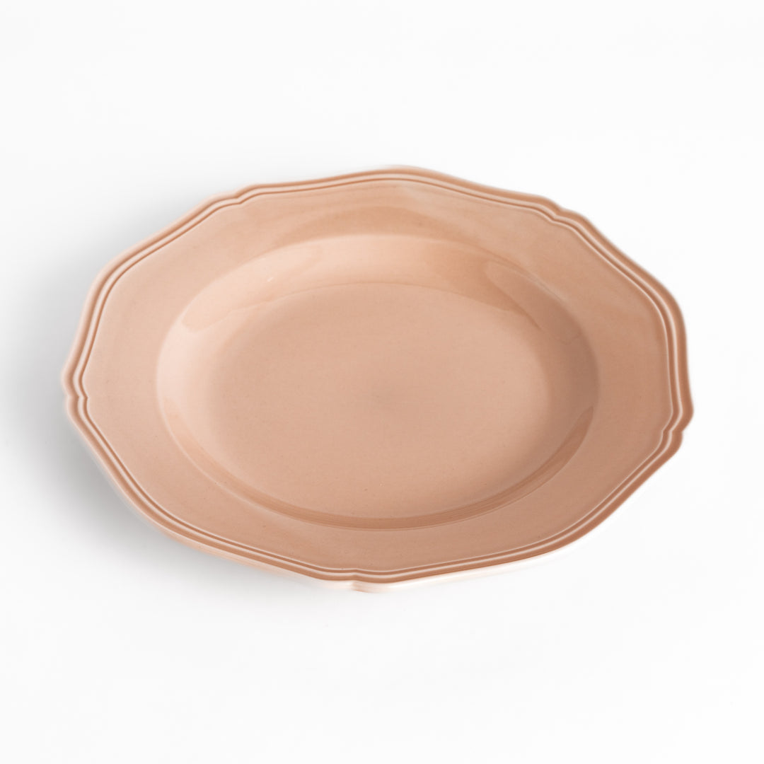 Pretty pink dinner plate with a delicate scalloped edge, ideal for showcasing your culinary creations.