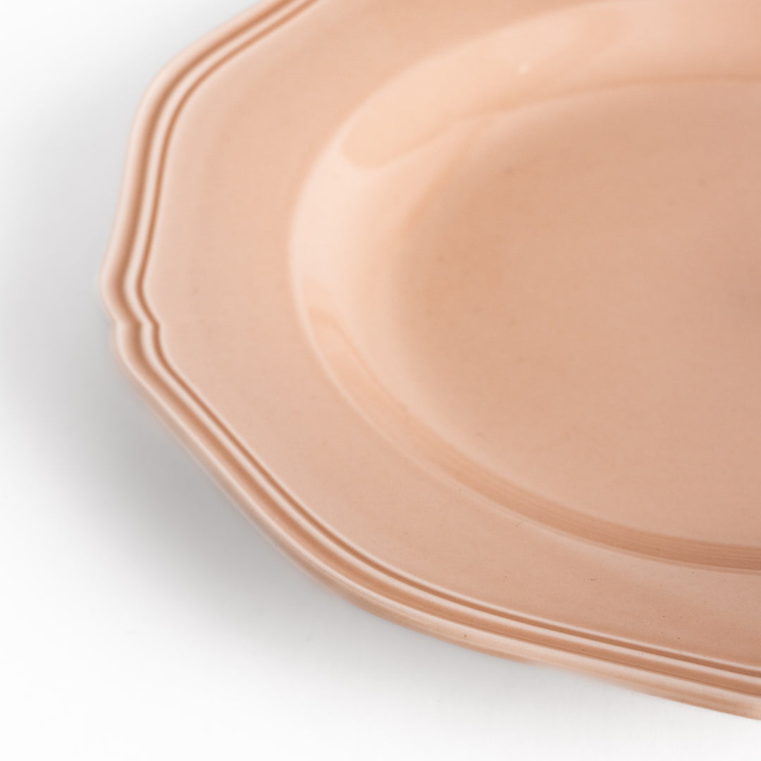 Pretty pink dinner plate with a delicate scalloped edge, ideal for showcasing your culinary creations.