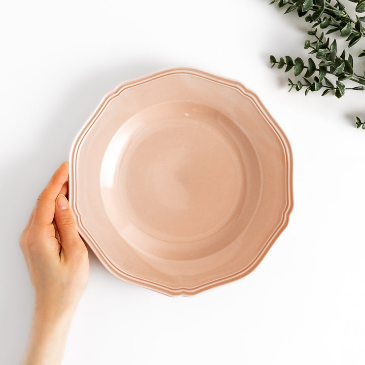 Pretty pink dinner plate with a delicate scalloped edge, ideal for showcasing your culinary creations.