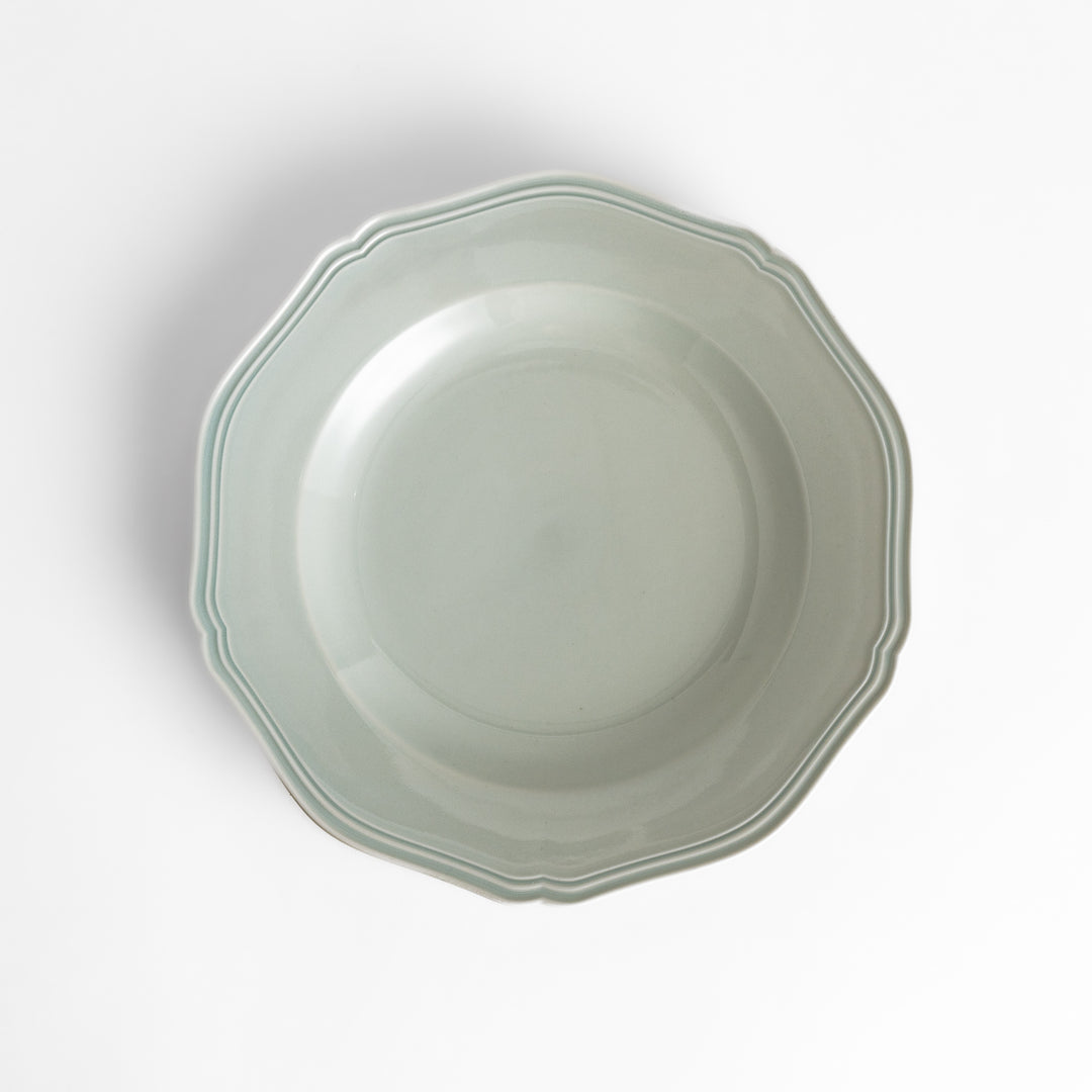 Pretty white dinner plate with a delicate scalloped edge, ideal for showcasing your culinary creations.